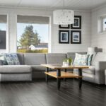 A living room filled with furniture and windows